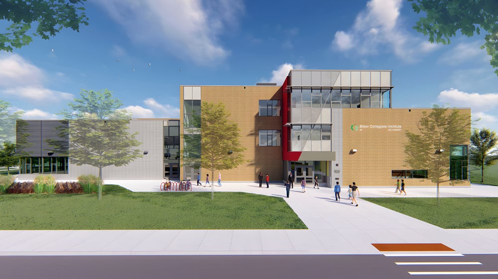 Das moderne mehrstöckige Gebäude des Bloor Collegiate Institute steht eingebettet in einer begrünten Umgebung mit Bäumen und einem gepflasterten Weg.