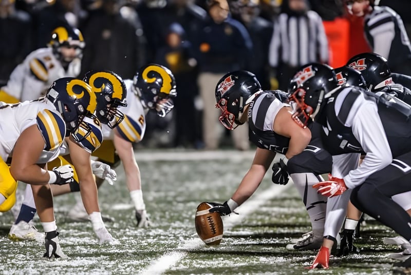 Schüler der Marquette High School stehen in Teamuniform bereit für den nächsten Spielzug im Footballspiel.