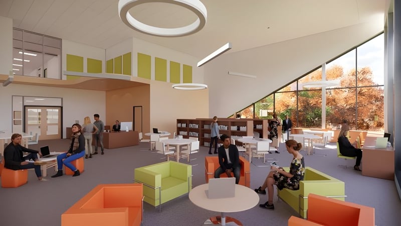 Moderne Bürofläche mit farbenfrohen Möbeln und großen Fenstern auf dem Campus der École secondaire publique Pierre de Blois.